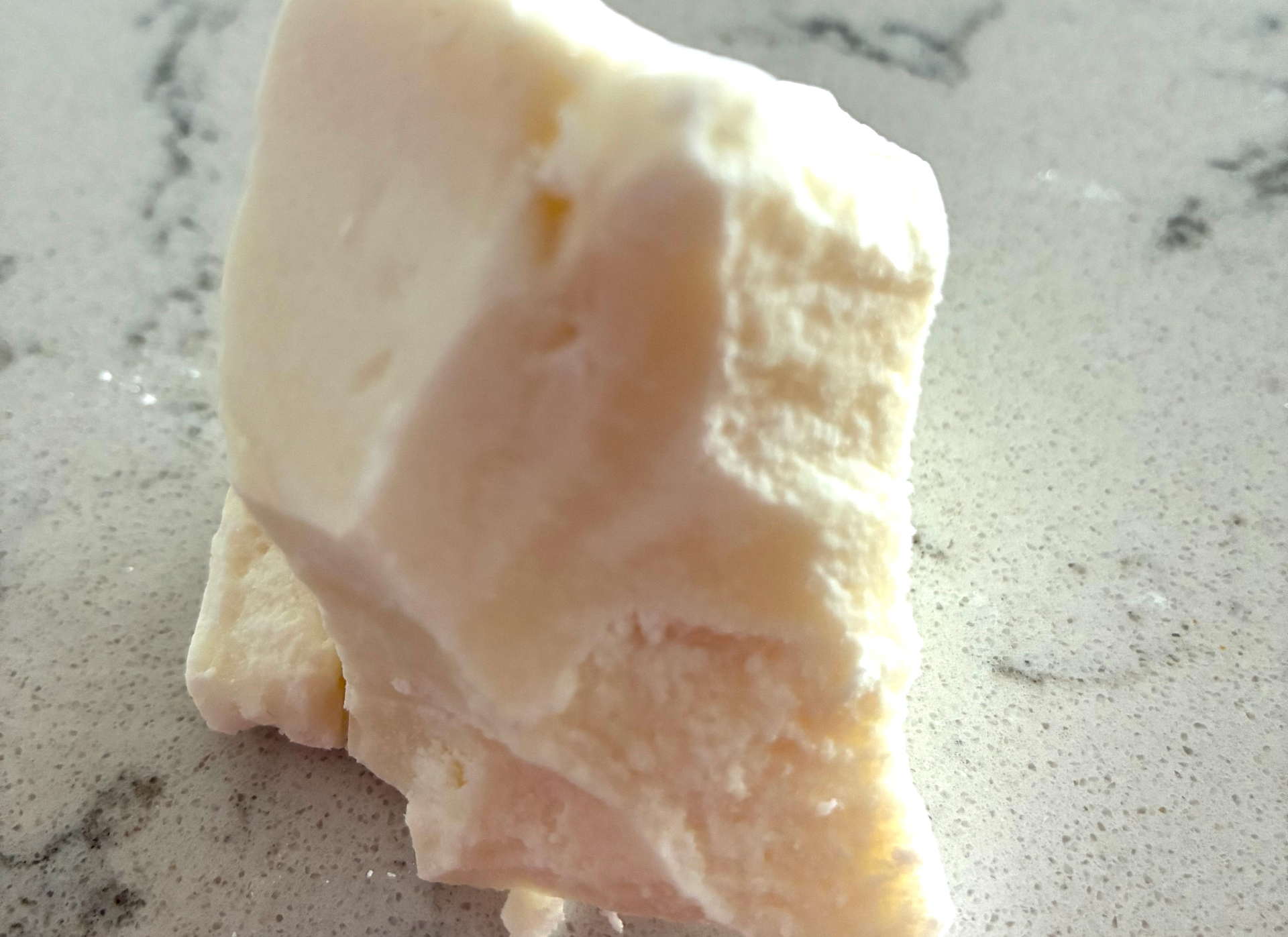 large chunk of white kokum butter sitting on a countertop